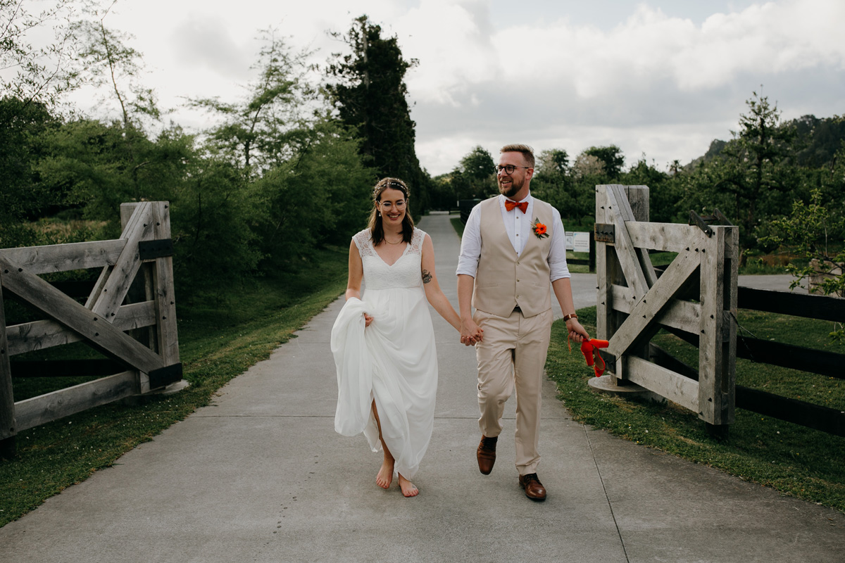 coatesville settlers hall wedding auckland bride and groom leaving Windmill Orchards by sarah weber photography