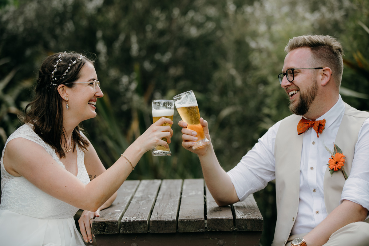 coatesville settlers hall wedding auckland bride and groom beer cheers photos by sarah weber photography