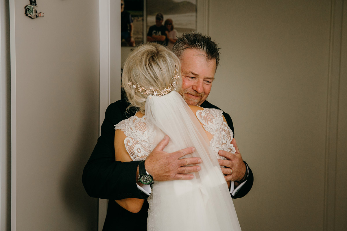 Bride and first look father daughter hug Auckland wedding photo by Sarah Weber Photography