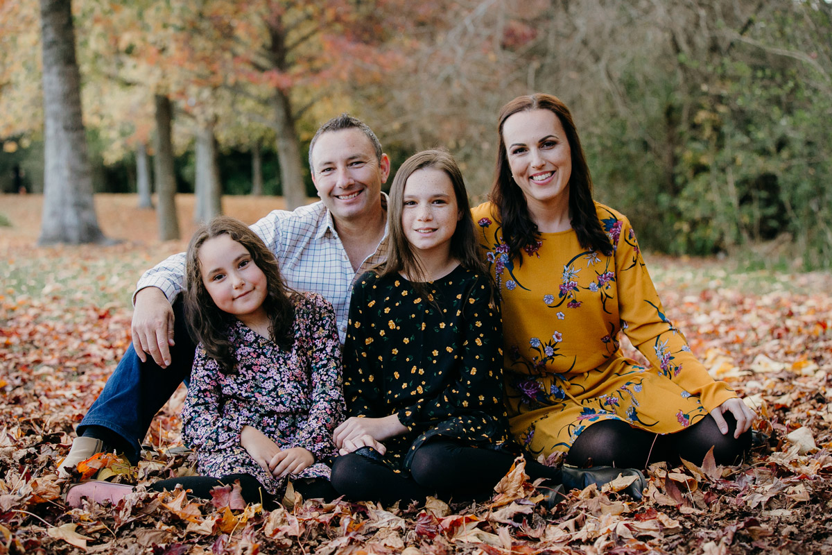family sitting in autumn lifestyle portrait photoshoot session in west auckland. Photos by sarah weber photography