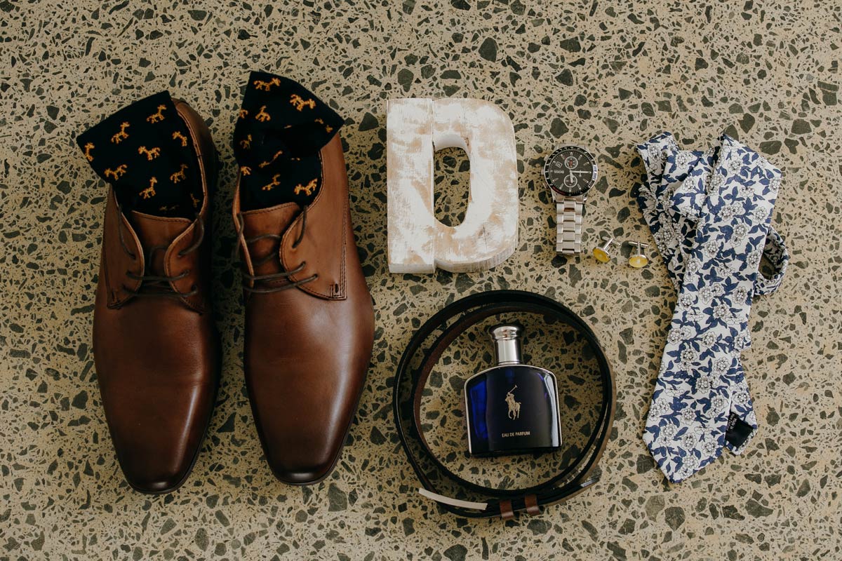 groom wedding details of shoes tie socks watch at omaha beach before stables matakana wedding by sarah weber photography