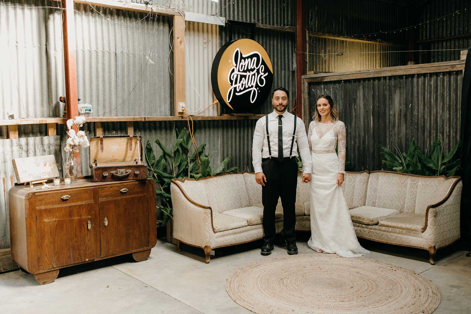 bride and groom portrait photos inside barn reception area at kumeu auckland by sarah weber photography