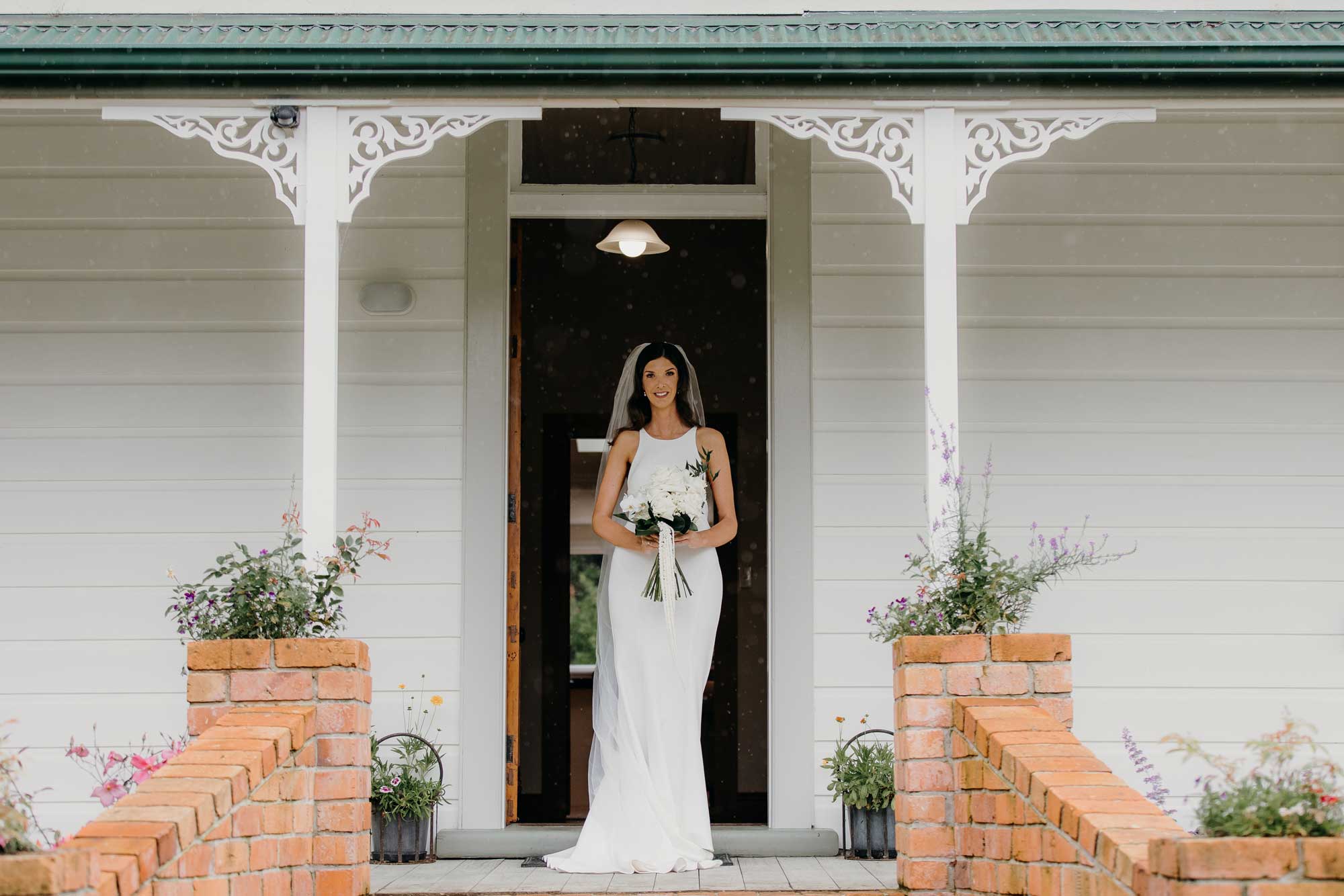 Bride in her wedding dress at The Crowe's Nest 82 Ingram Road Bombay, Auckland photo by Sarah Weber Photography